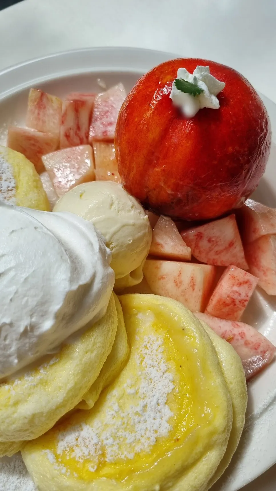 Fluffy soufflé pancake and a peach cross-section
