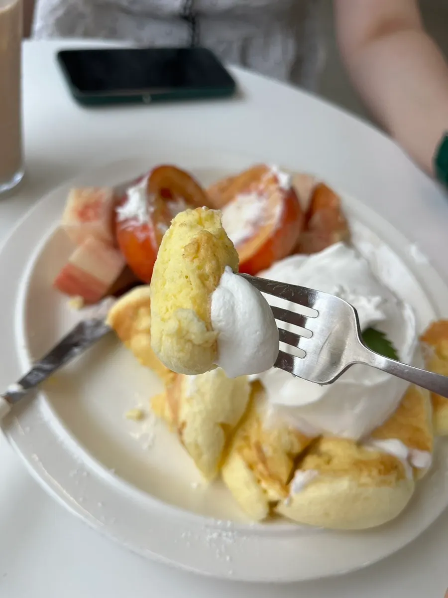 A slice of peach soufflé with cream