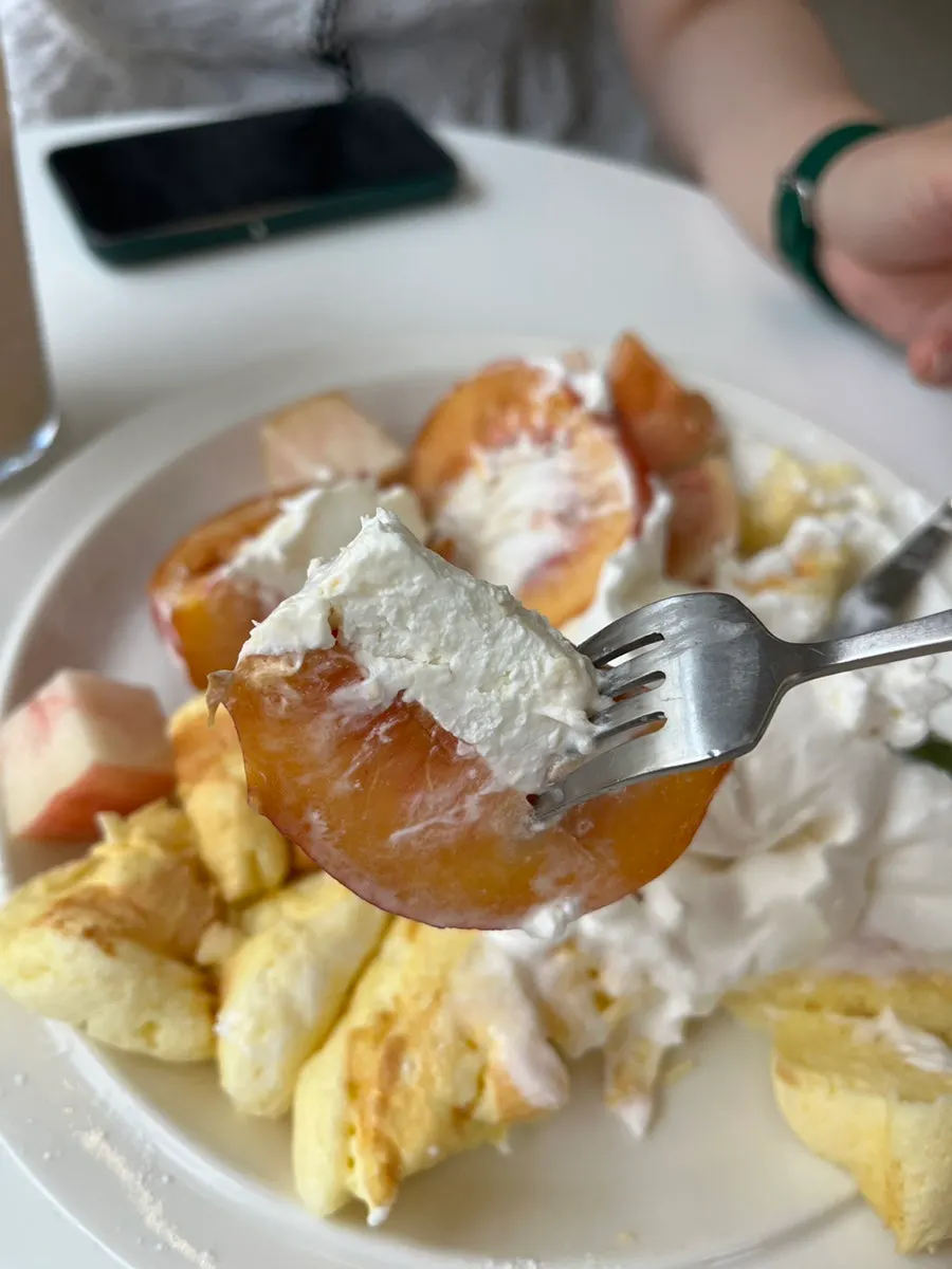 Whole peach dessert filled with yogurt