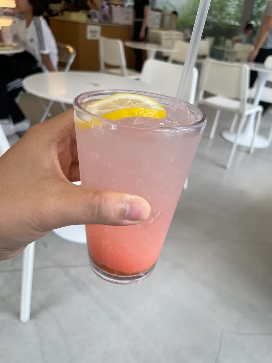 Iced americano served alongside the soufflé