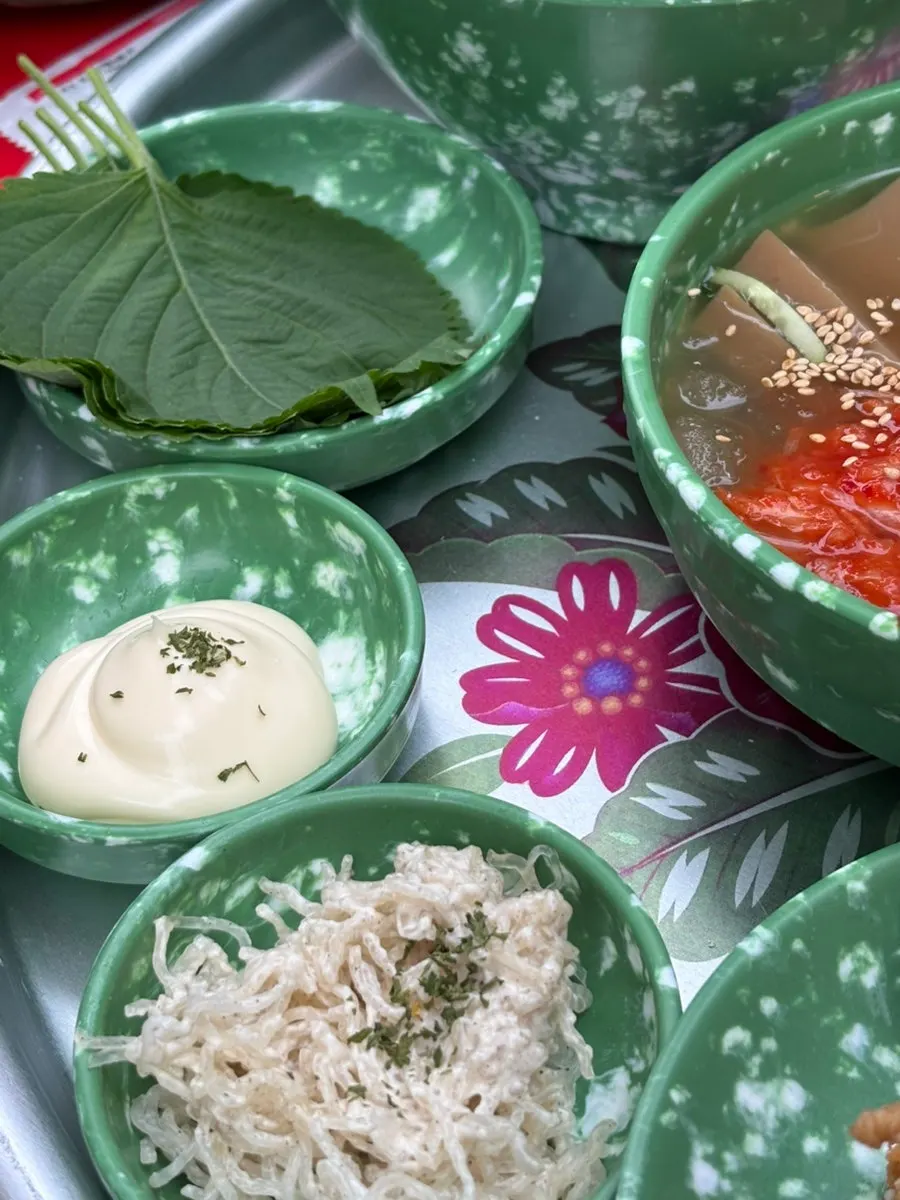 Spicy kalguksu noodles and tuna mayo rice ball