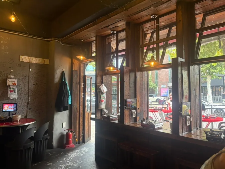 Wide shot of the interior at Cheongnyeon Dakbal 1987 Hongdae Branch