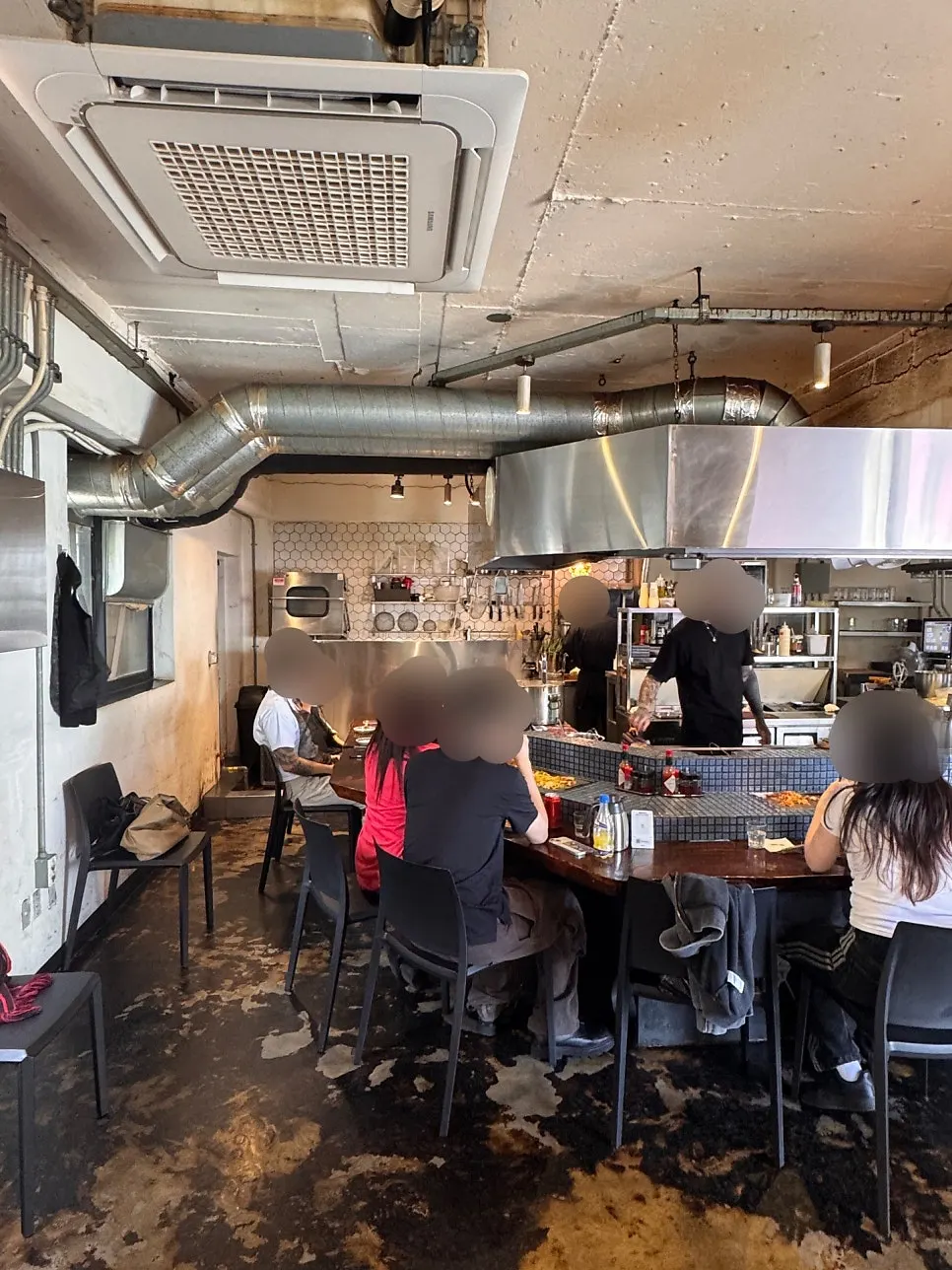 Restaurant interior with an exposed concrete ceiling