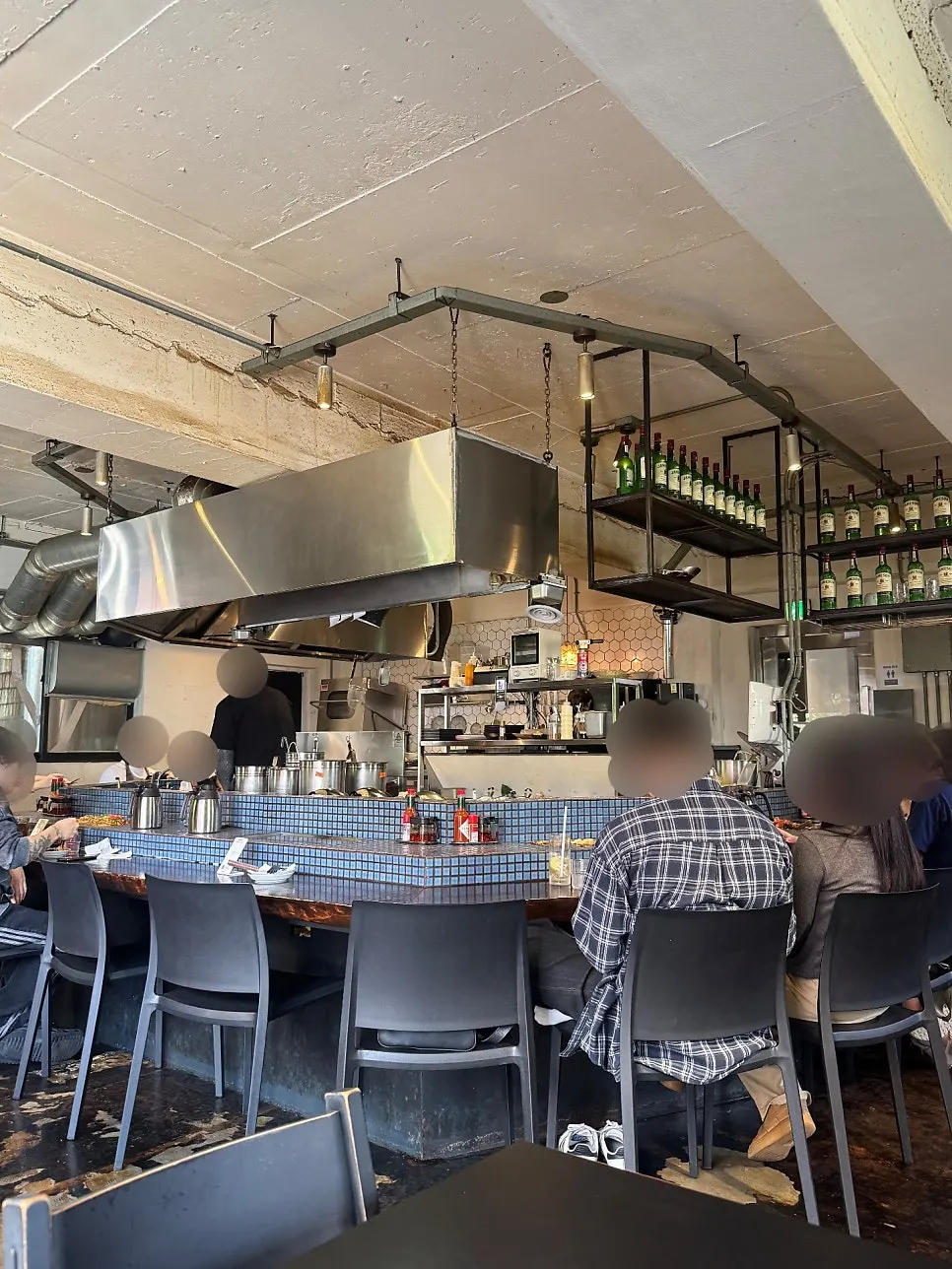 Restaurant interior with dark seating and lighting