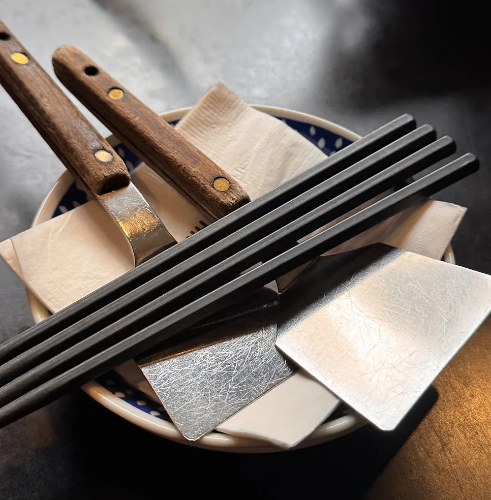 Table set with mini spatulas and chopsticks