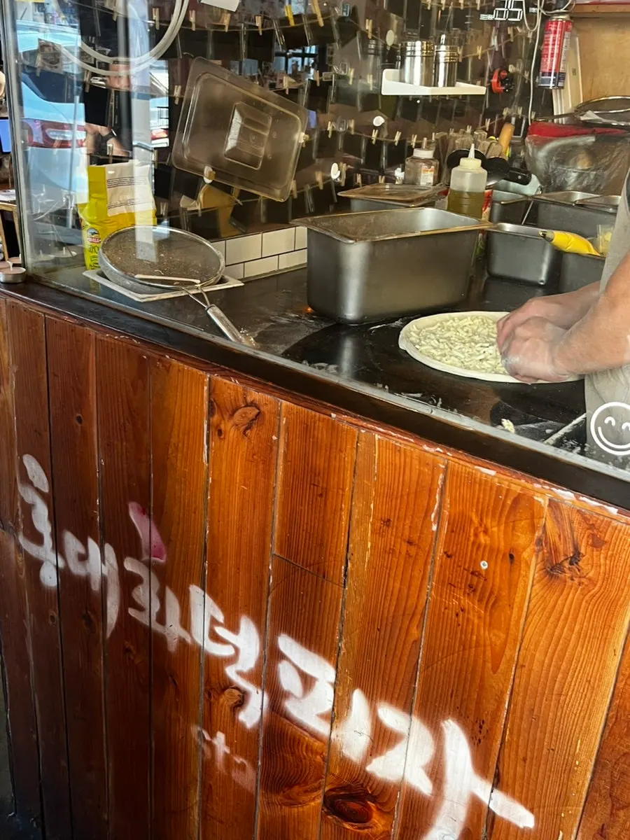 Wood-fired oven and tables inside the restaurant