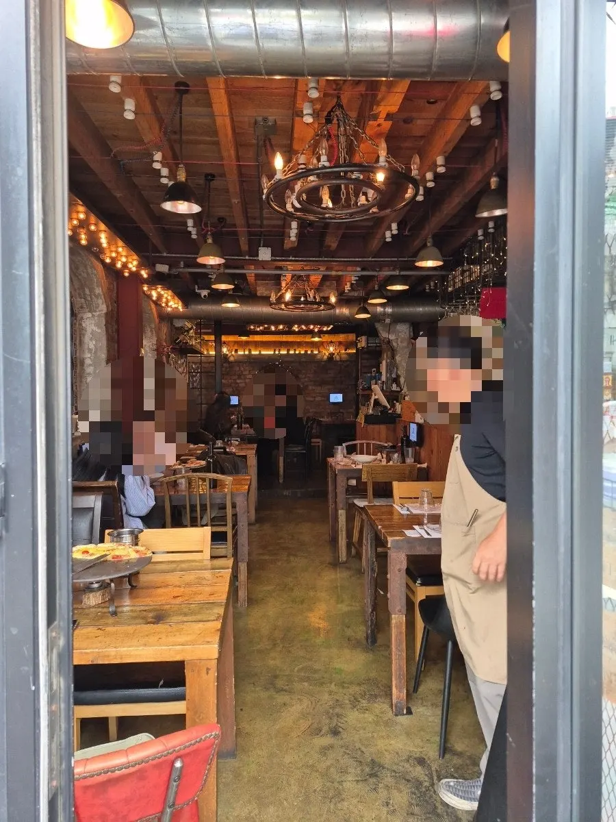 Alleyway leading to Hongdae Hwadeok Pizza