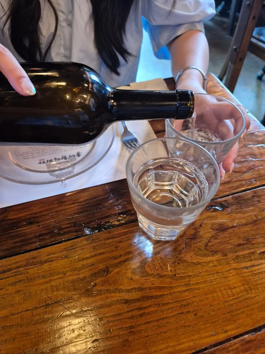 Water served in a wine bottle-style container