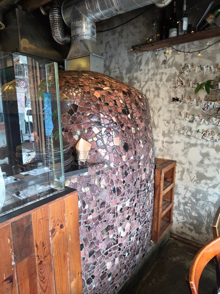 The pizza wood-fired oven in the kitchen at Hongdae Hwadeok Pizza