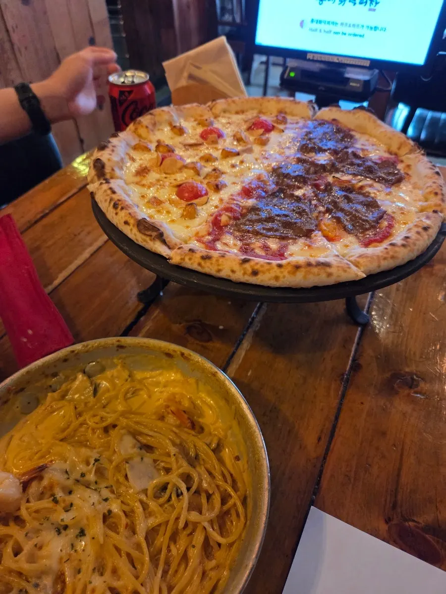 Close-up of the garlic chip and shrimp toppings on Crocante pizza