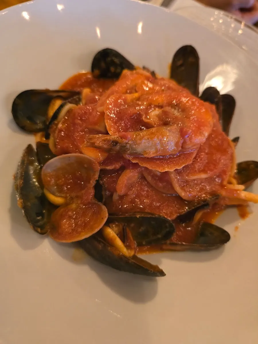 Close-up of the rich tomato sauce seafood pasta