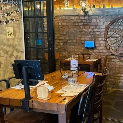 Seating area with an arched window in the restaurant
