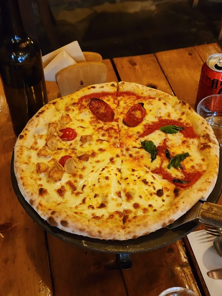 A slice of pizza with stretchy natural mozzarella