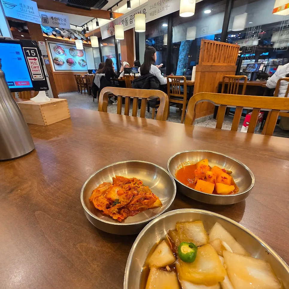 Entrance of Yukjeon Gukbap Seogyo Branch with parking space out front