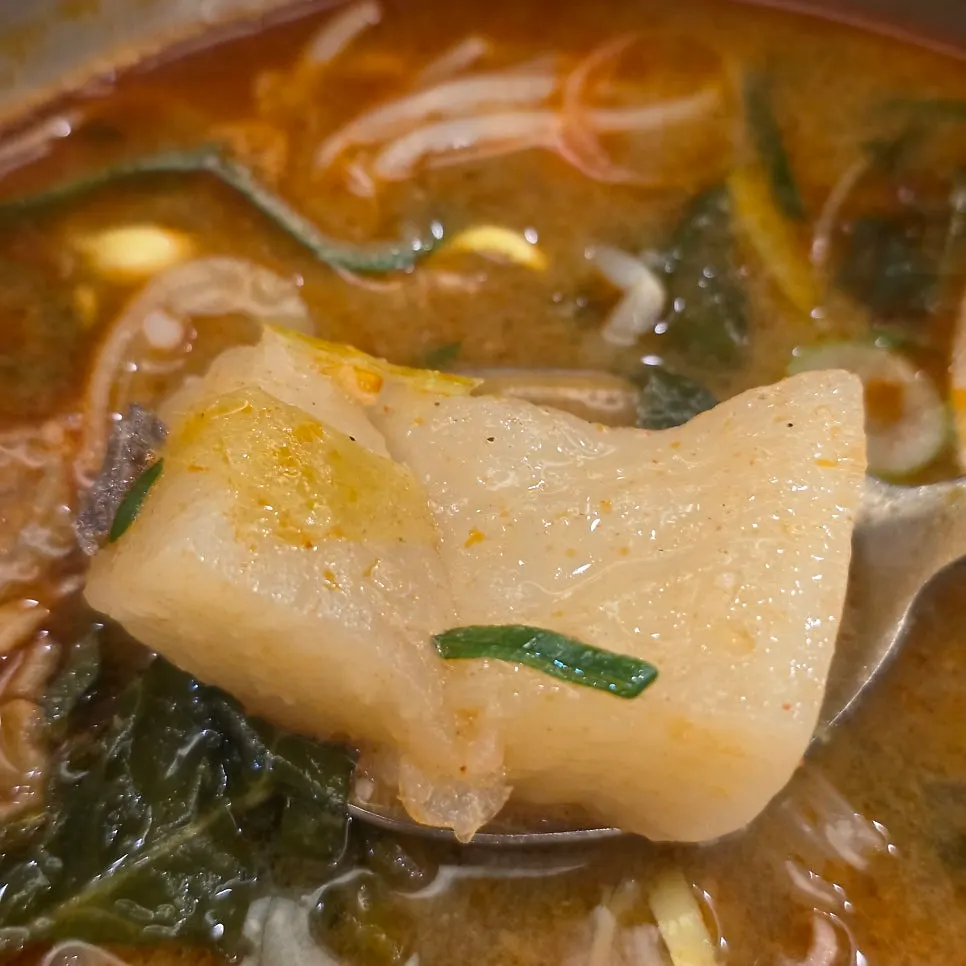 A spoonful of spicy gukbap mixed with rice