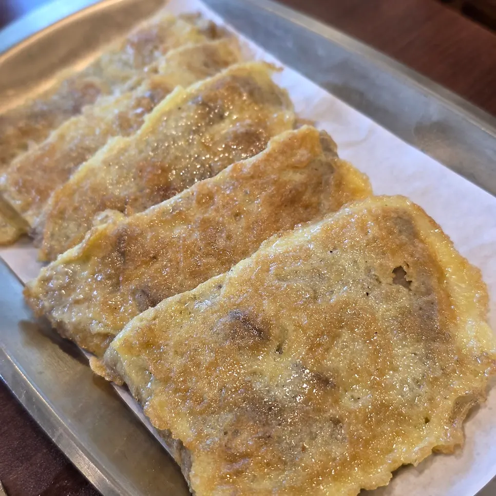Yukjeon placed on top of gukbap for the perfect bite