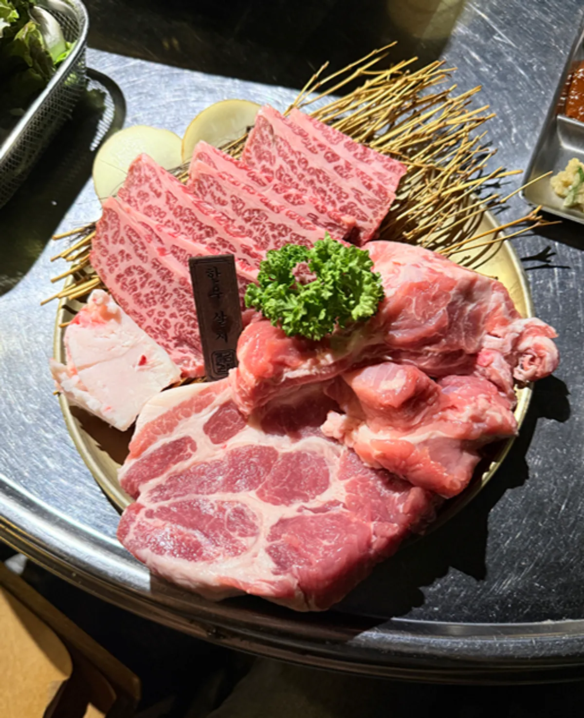 Plate of raw beef and pork from the set for two