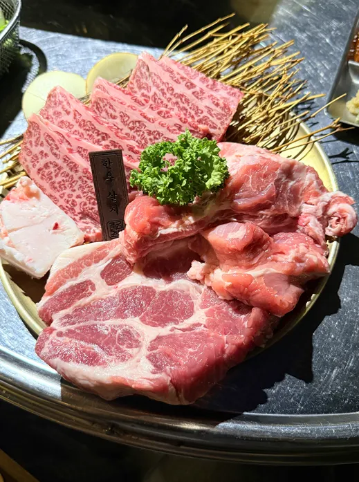 Thick-cut pork neck grilling on the pan