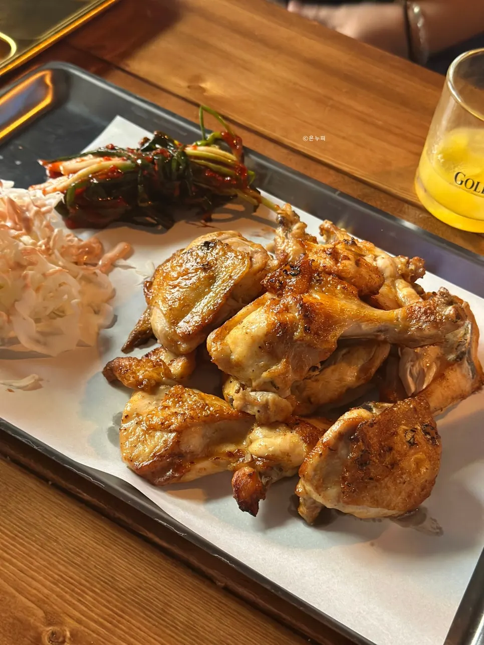 Close-up of charcoal-grilled boneless chicken thigh with salt seasoning