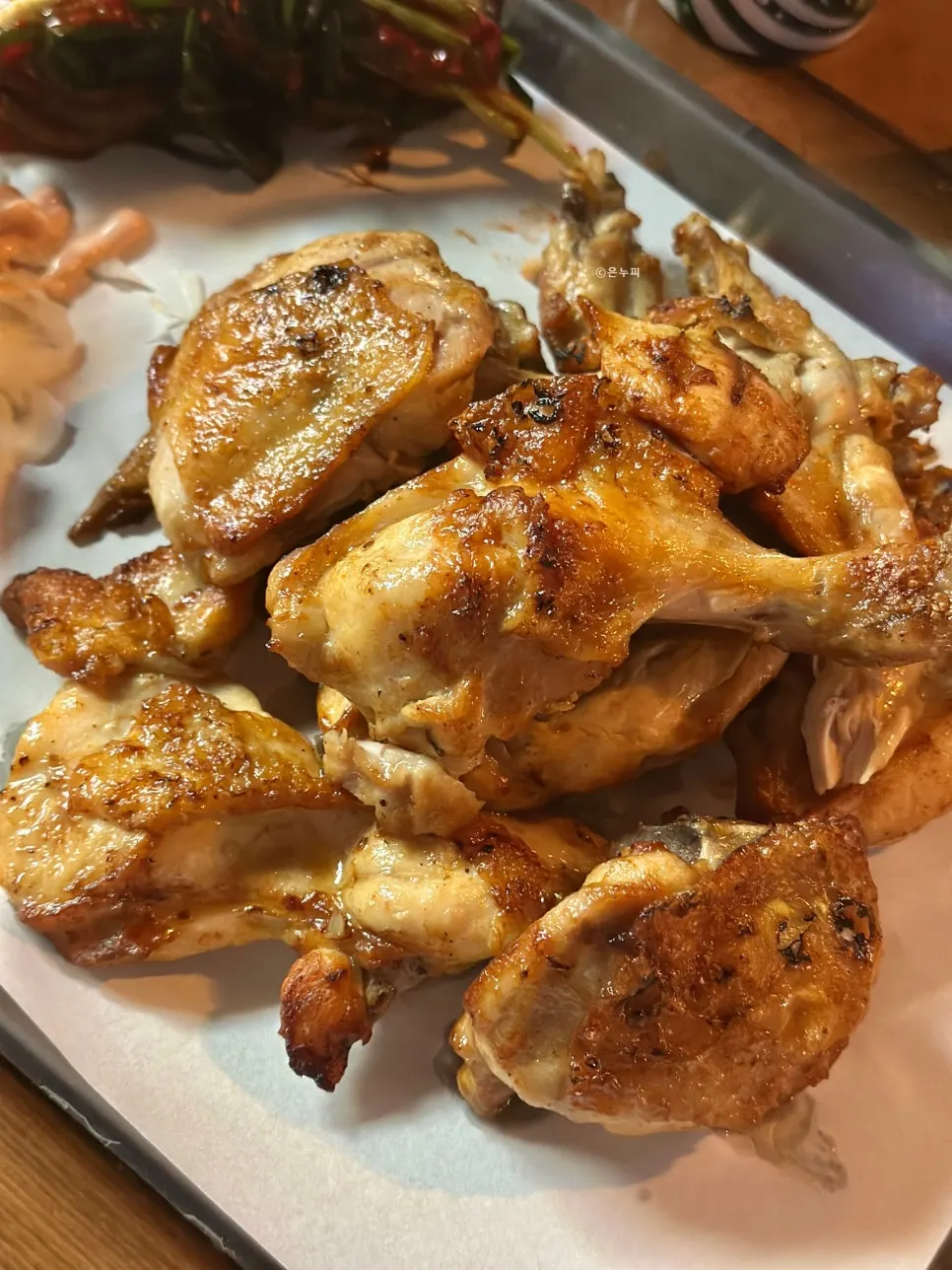 A piece of salt-seasoned charcoal-grilled chicken