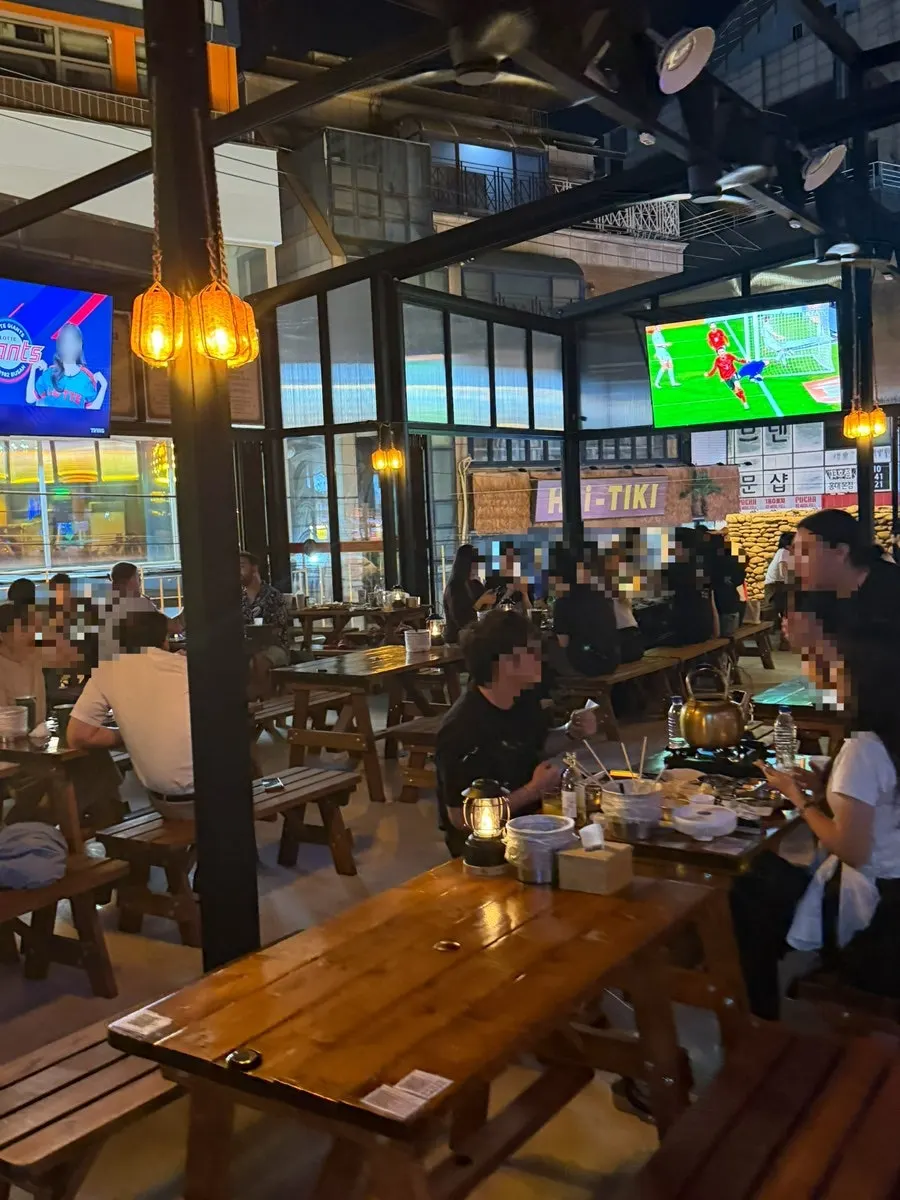 Table seating with a large screen in view