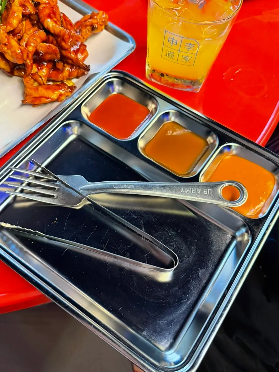 A large side plate filled with various sauces