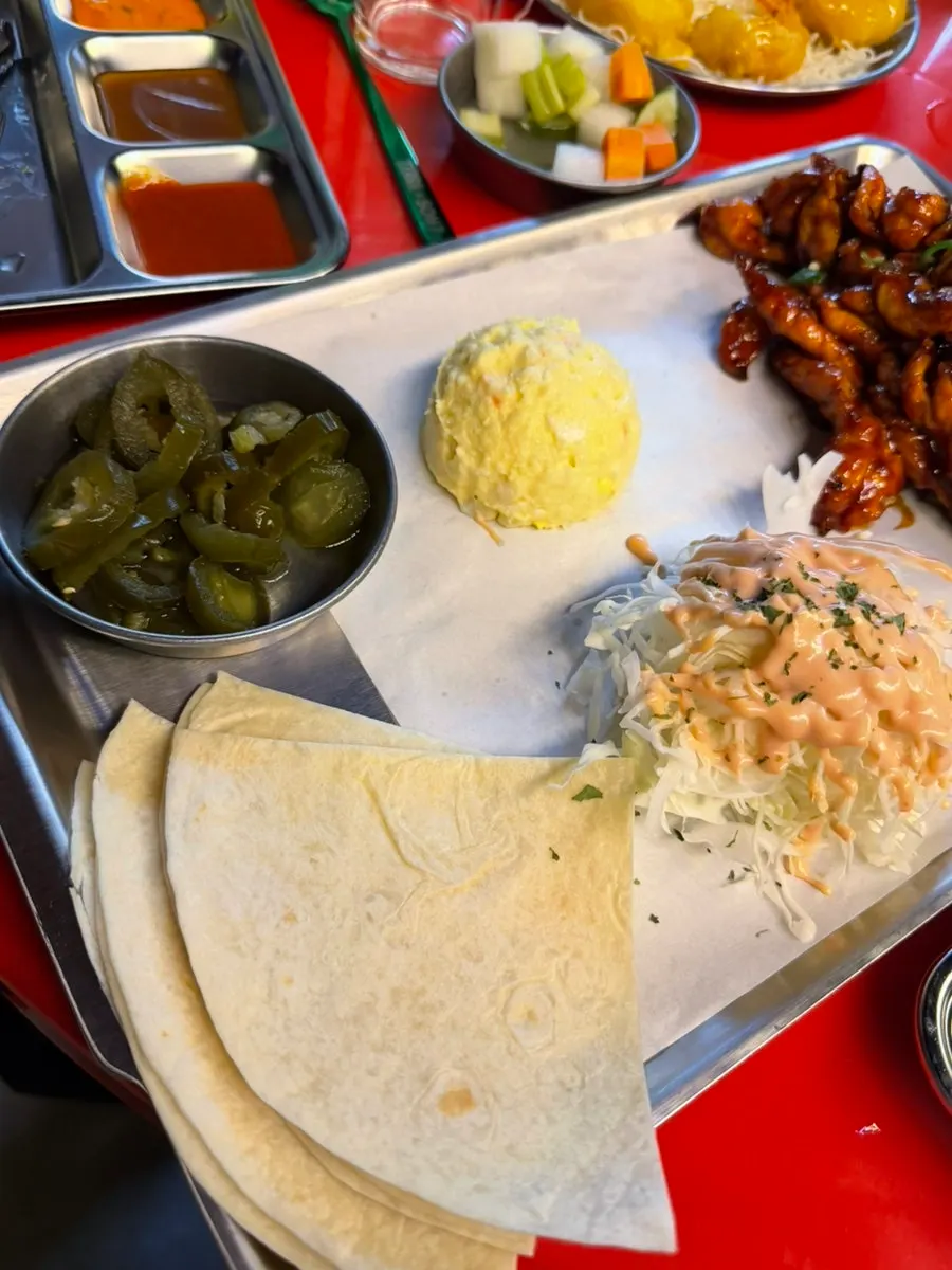 Tortillas served alongside the chicken neck