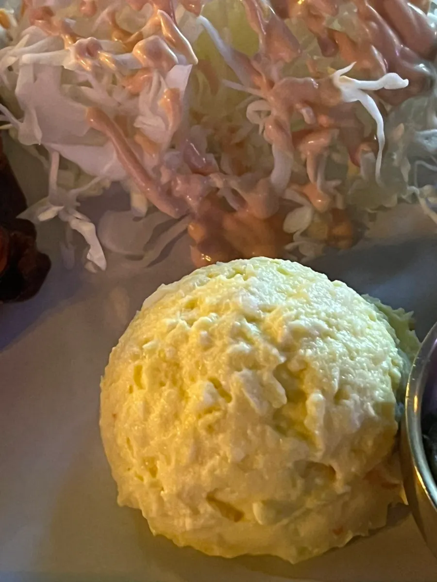 Wrapping chicken neck and salad in a tortilla