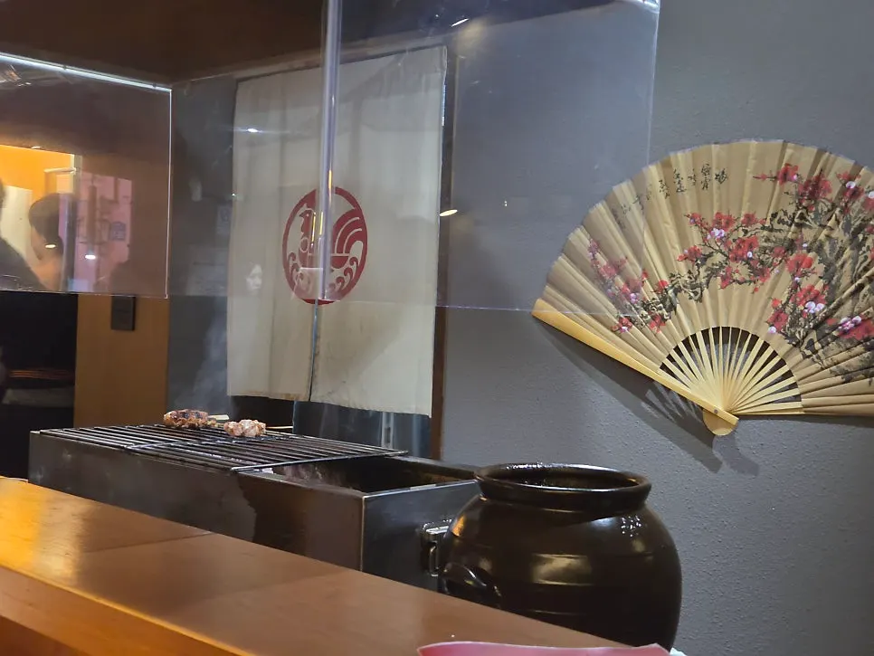 Bar counter and lighting at Yakitori Iyu