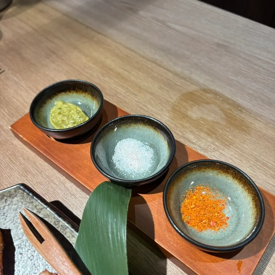 A piece of yakitori with salt and pesto