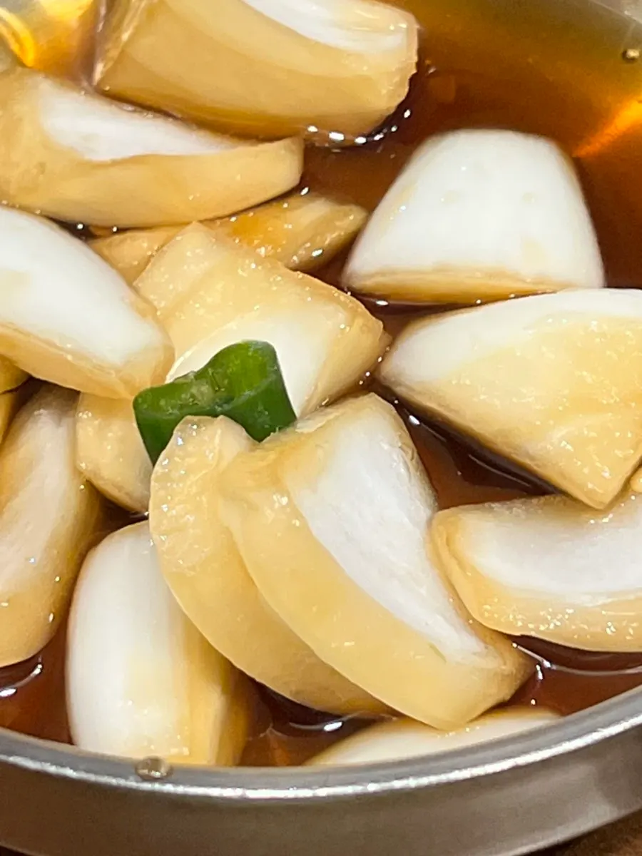 A bubbling hot pot of beef gukbap