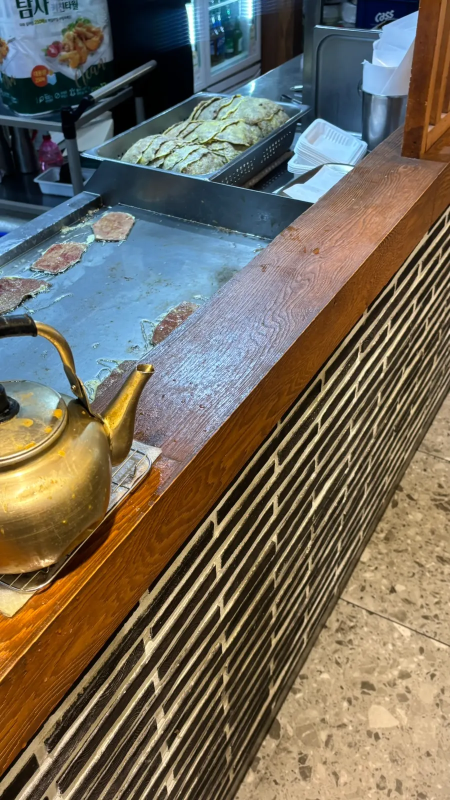 Griddle with pancakes turning golden brown