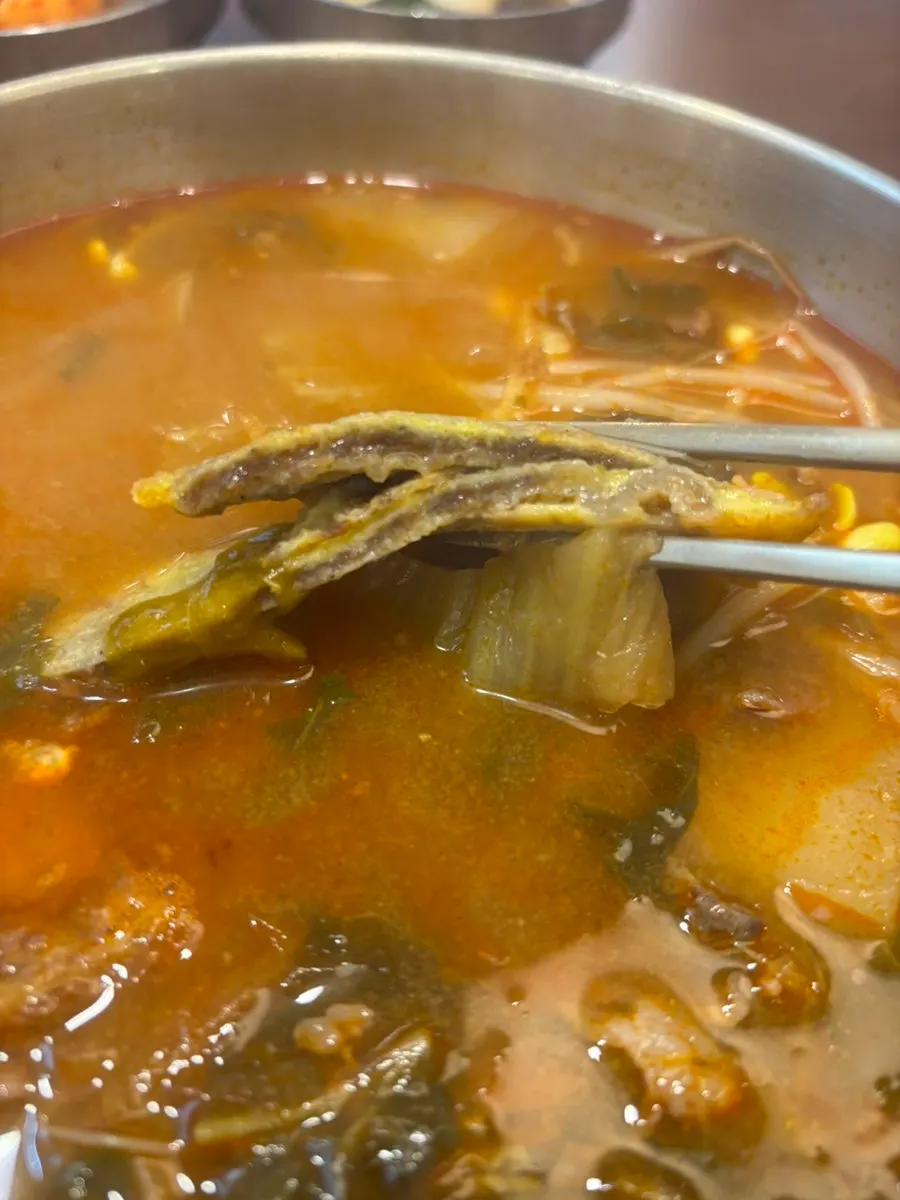 Generous spread of beef pancake gukbap on the table