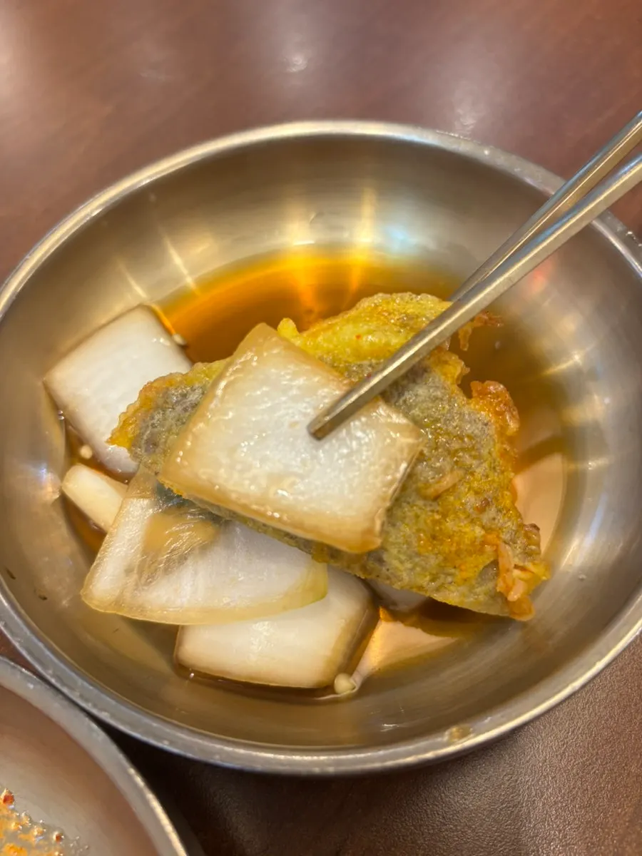 Beef pancake gukbap piled high with beef pancake and meat over broth