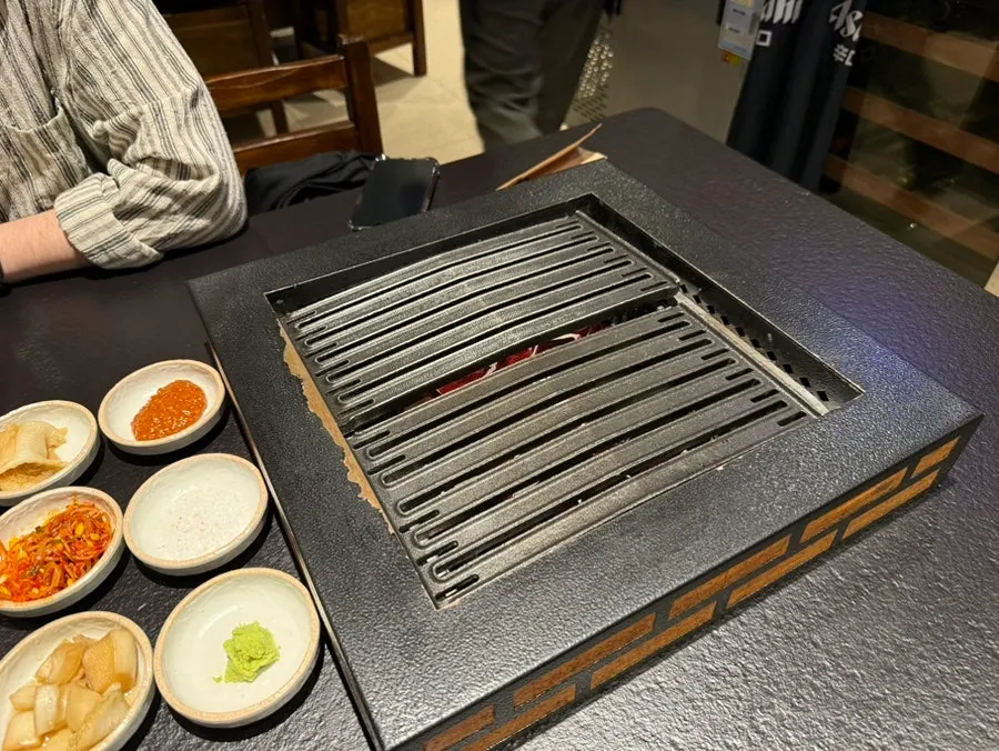 Grill plate set on top of the charcoal