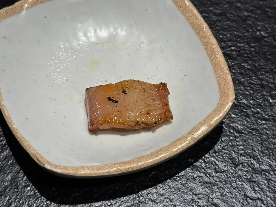 Grilled thin-trimmed pork neck with the chewy bit attached