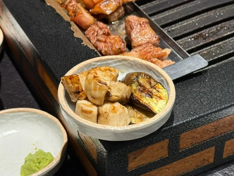 Mushrooms and eggplant grilled alongside the meat