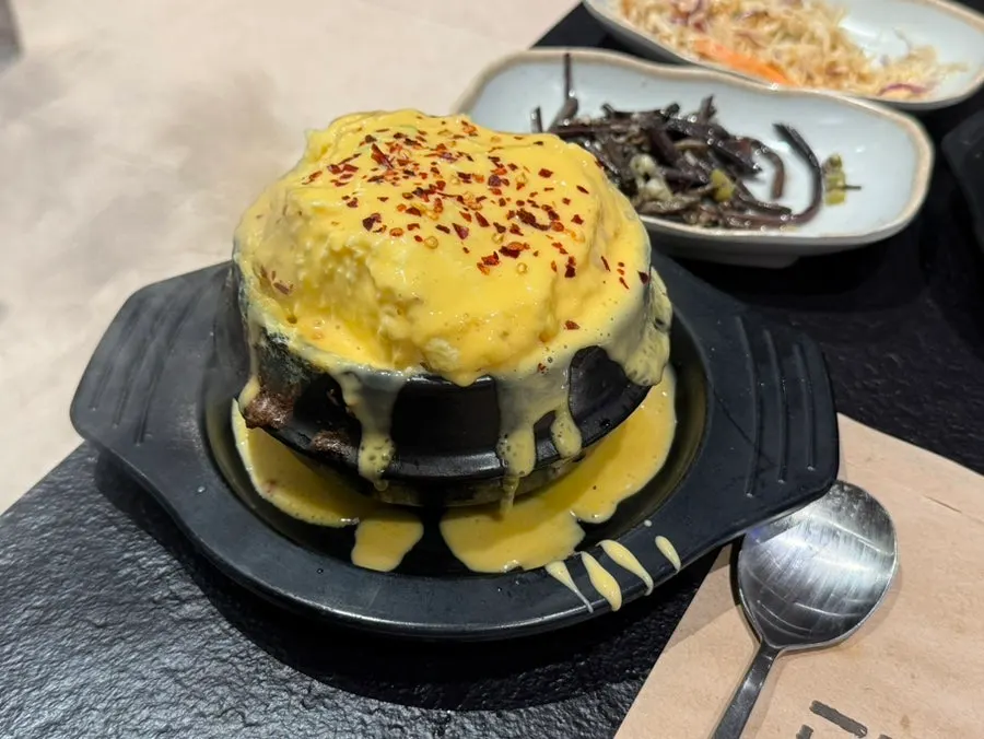 Steamed egg piled generously with cheddar cheese