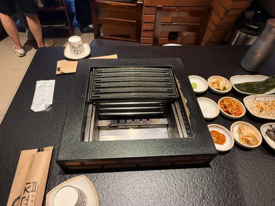 Side menu board with doenjang stew, naengmyeon, and more