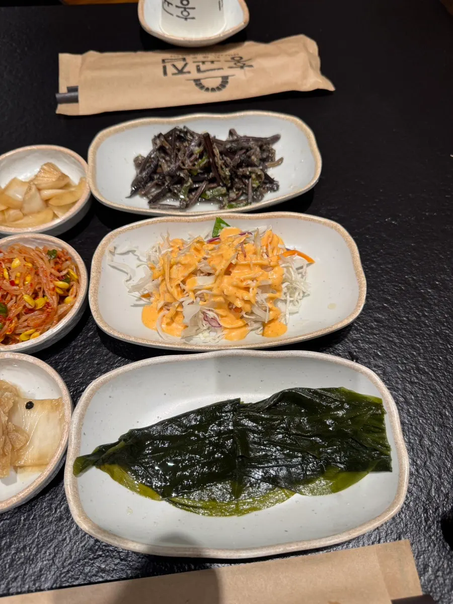Close-up of side dish plates and wrap vegetables