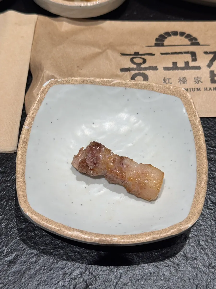 Meat cut into bite-sized pieces and moved to the top of the grill