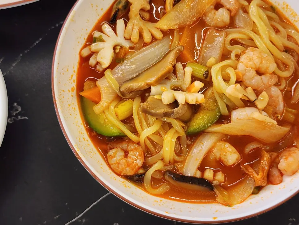 A spoonful of spicy jjamppong broth