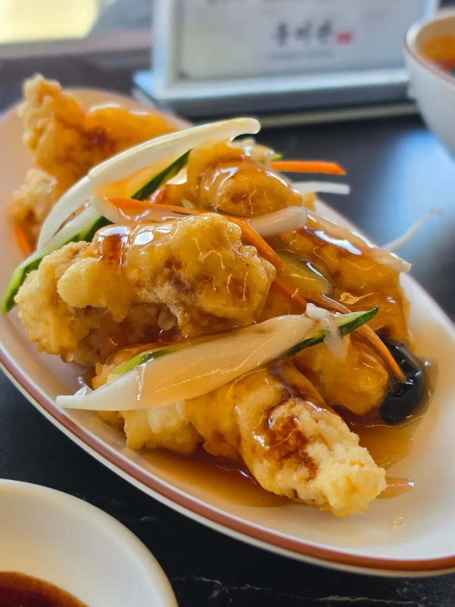 Close-up of freshly fried tangsuyuk coating