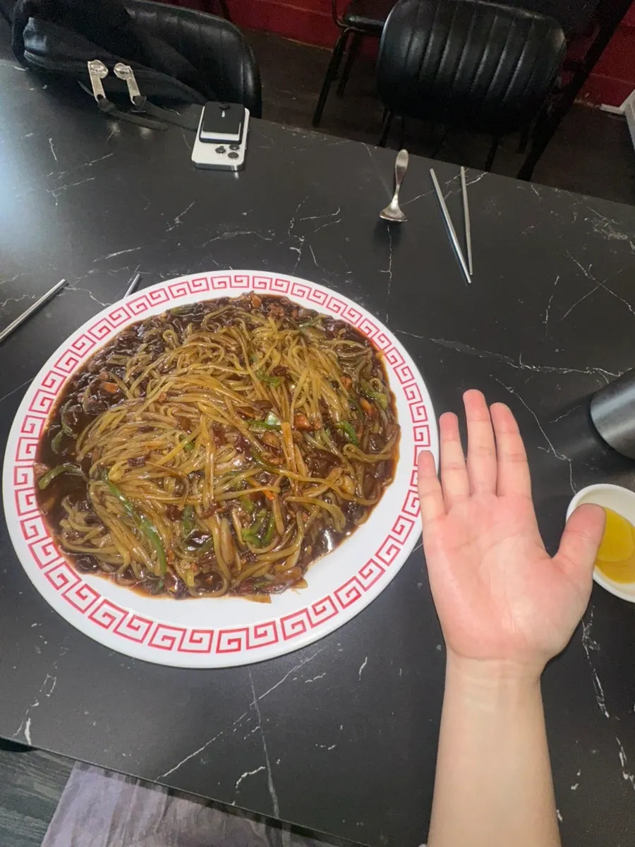 Plate of pickled radish and raw onion from the self-serve bar
