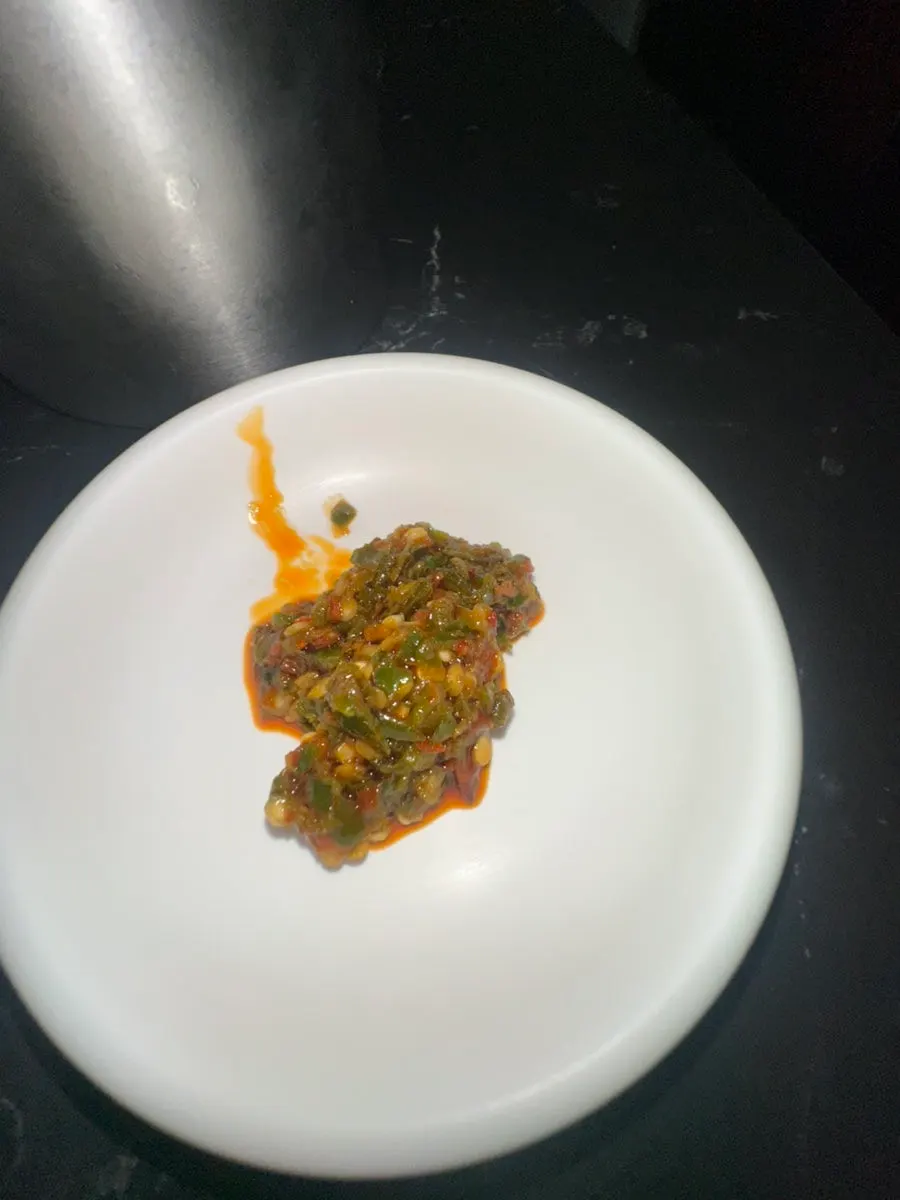 A plate of pickled gochujjangajji served by staff