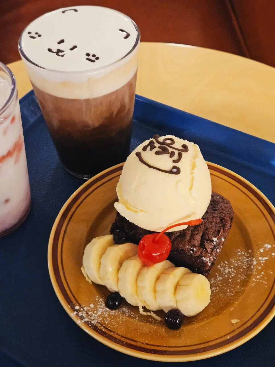 Bear-art drink and dessert on a vintage table