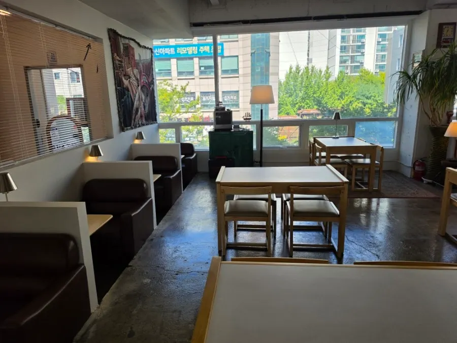 Café space lined with regular tables