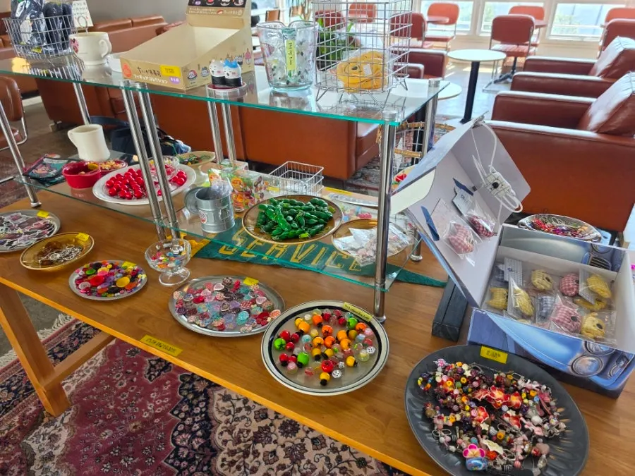 Keyring sales corner set up in the middle of the café