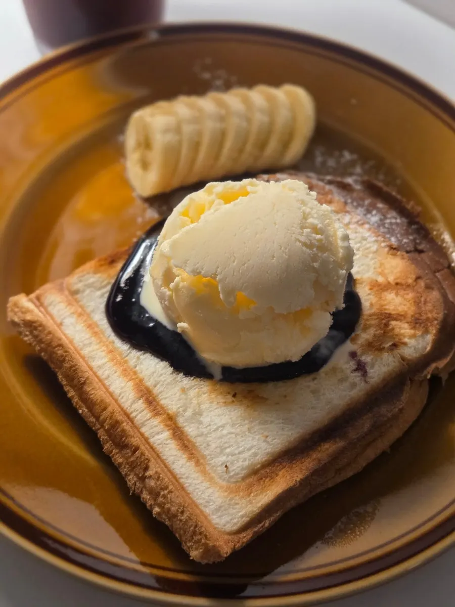 Ex-Boyfriend Toast topped with cream cheese and blueberry jam