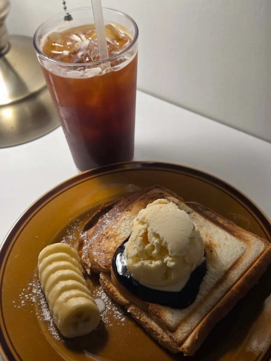 A cut piece of Ex-Boyfriend Toast being eaten